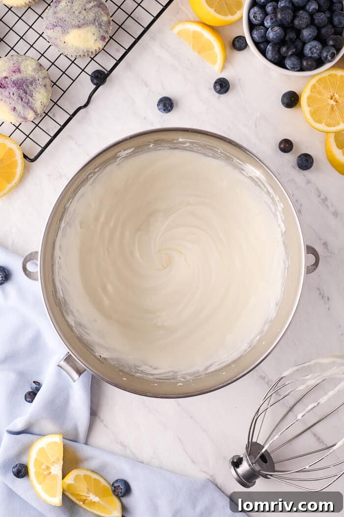 Cream cheese being whipped in a stand mixer