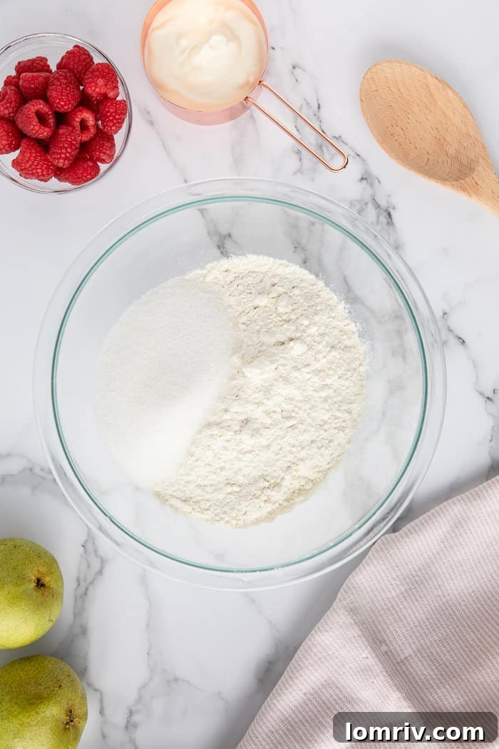 Dry ingredients for Pear and Raspberry Bread being mixed in a bowl.