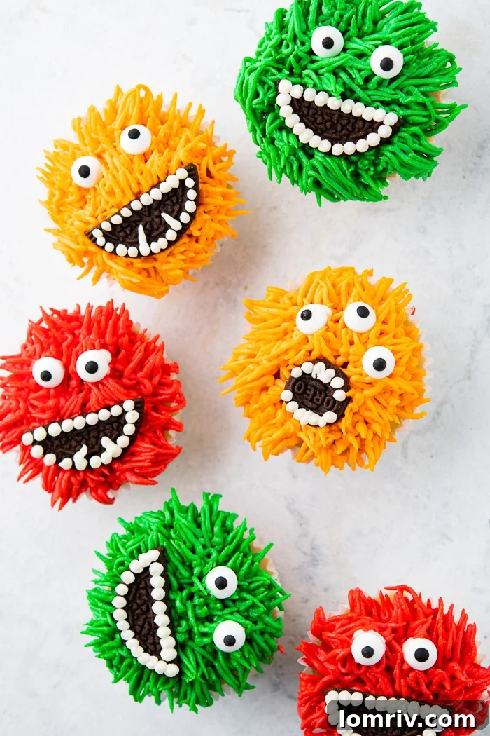 Cute Halloween Monster Cupcakes - A vibrant, fun monster cupcake with green frosting and playful candy eyes.