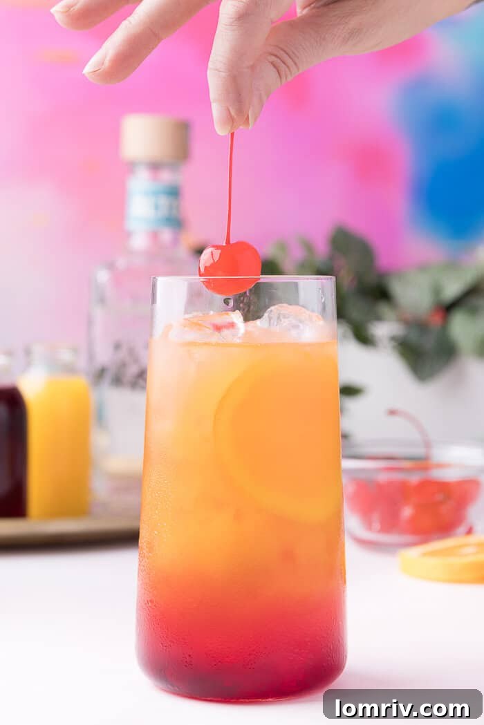 Two vibrant Tequila Sunrise cocktails ready to be served, showcasing the beautiful gradient.