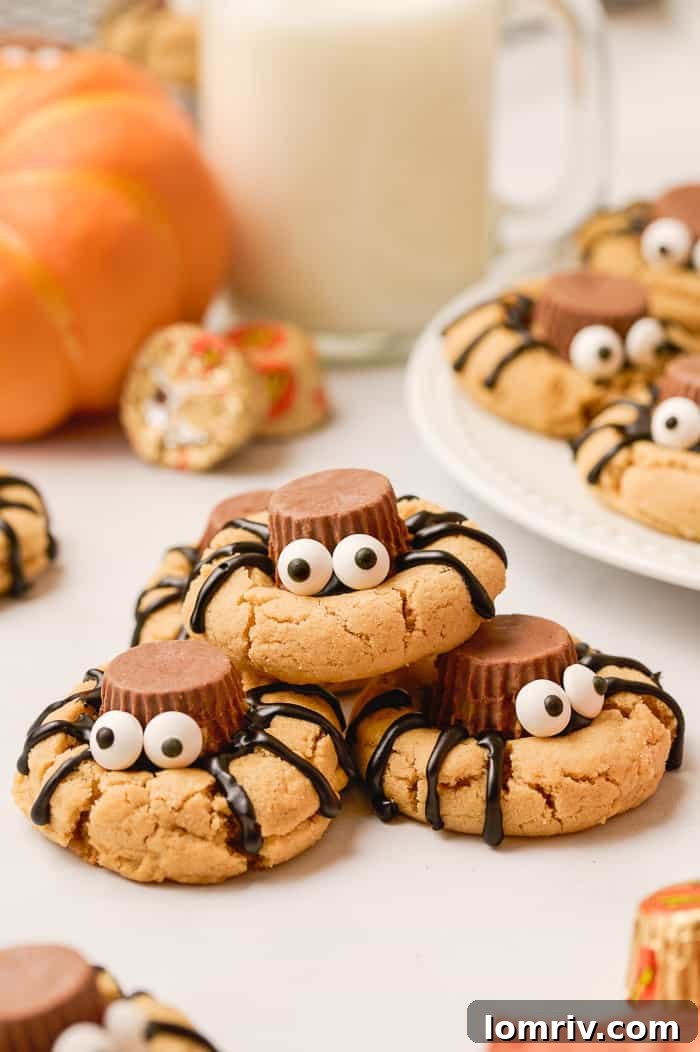Spider peanut butter cookies stacked on top of each other, ready for Halloween.