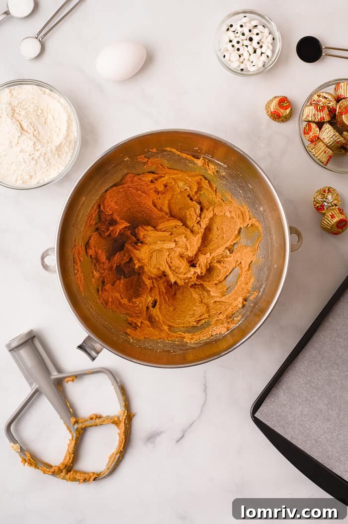 Mixing peanut butter into the dough.