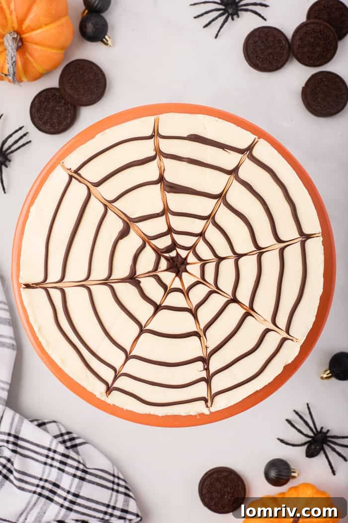 A stunning no-bake spider web cheesecake, elegantly presented amidst charming Halloween decorations, ready to be the star of any October gathering.