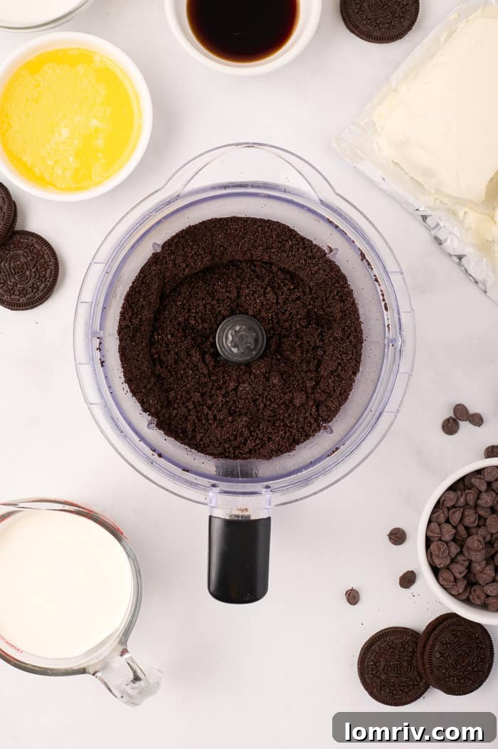 Finely crushed Oreo crumbs, ready to be mixed with melted butter for the cheesecake crust.