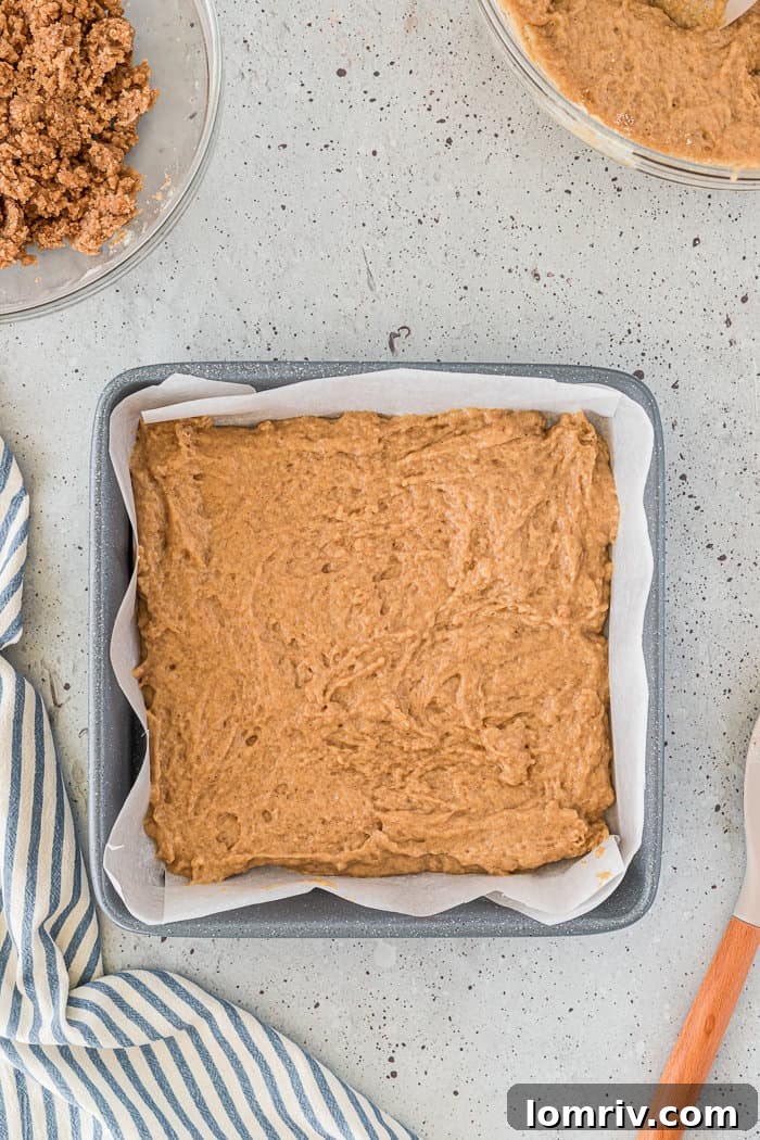 First layer of chai coffee cake batter in pan