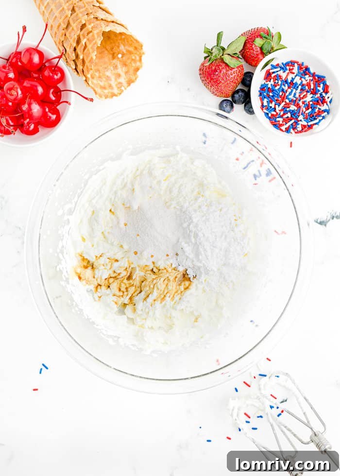 Cold heavy cream being whipped in a bowl.