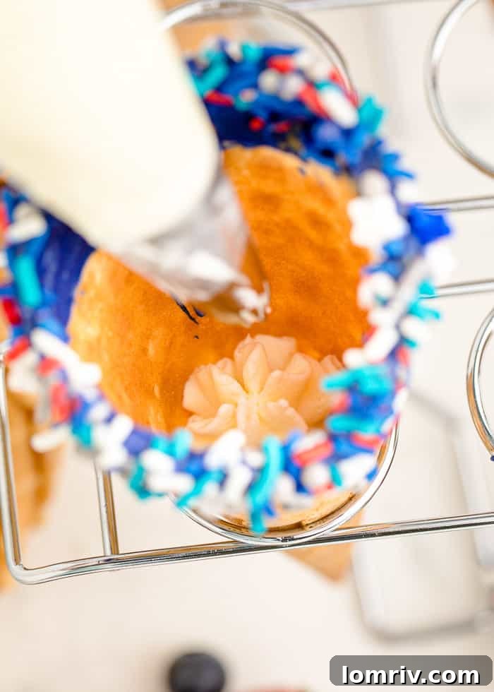 First layer of cheesecake whipped cream piped into a waffle cone.