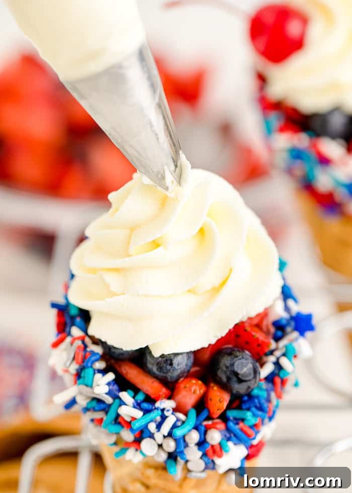 Top layer of cheesecake whipped cream piped onto the cone.