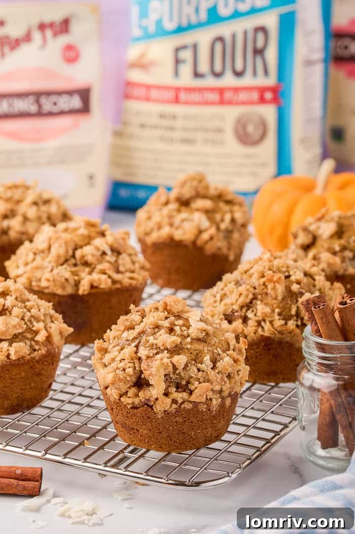 Deliciously moist pumpkin muffins with streusel topping, perfect for fall.
