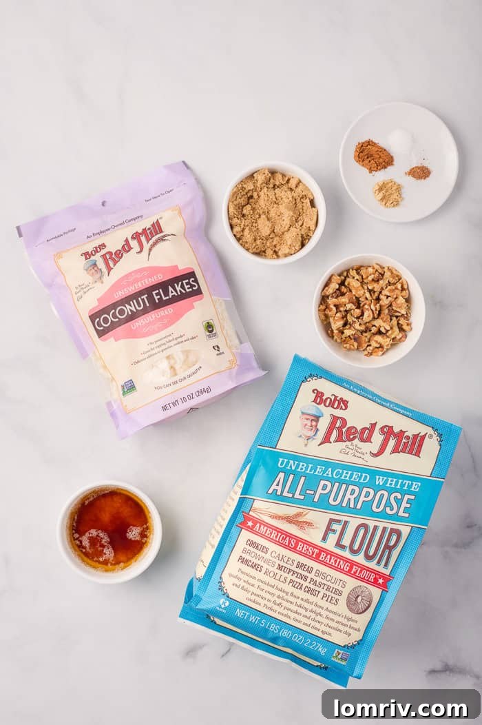 Close-up of ingredients specifically for the streusel topping, including chopped nuts and coconut flakes.