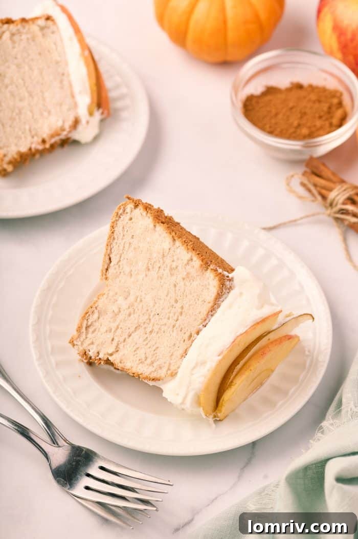 A slice of pumpkin spice angel food cake on a plate.