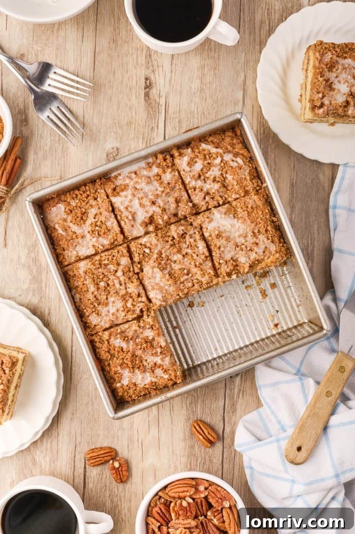 Sour cream coffee cake, freshly baked and neatly cut into individual servings within the baking pan.