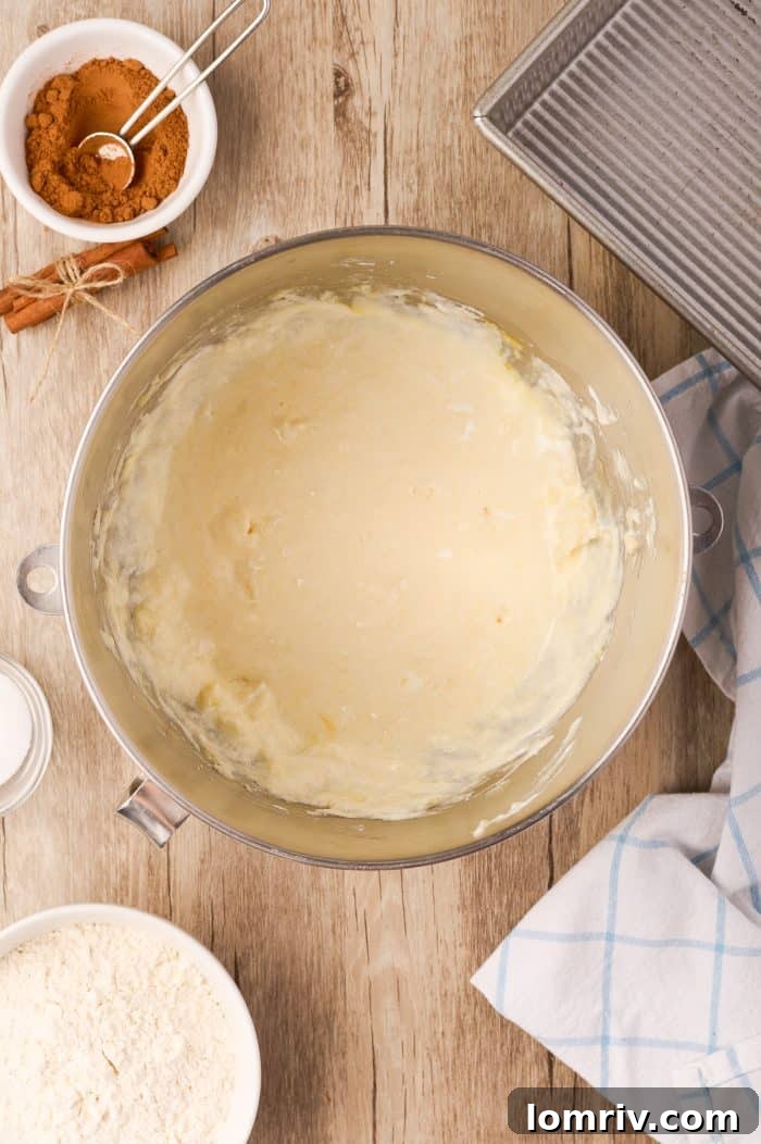 All wet ingredients for the coffee cake batter thoroughly combined in a mixing bowl.