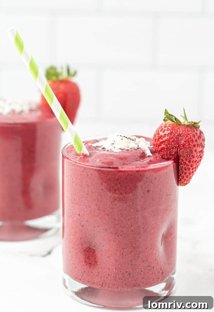 Top-down view of Very Berry Coconut Chia Smoothie with scattered berries