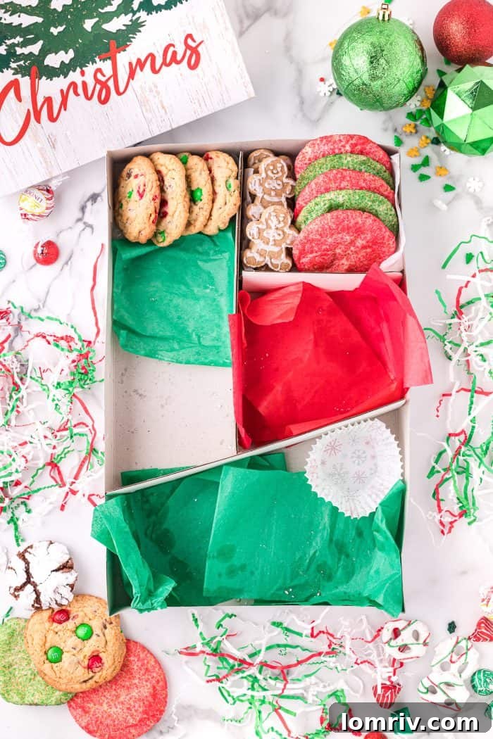 Adding more festive treats to the cookie box.
