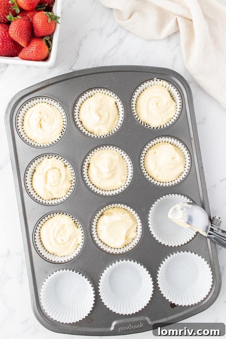 Fill the cupcake liners with batter.