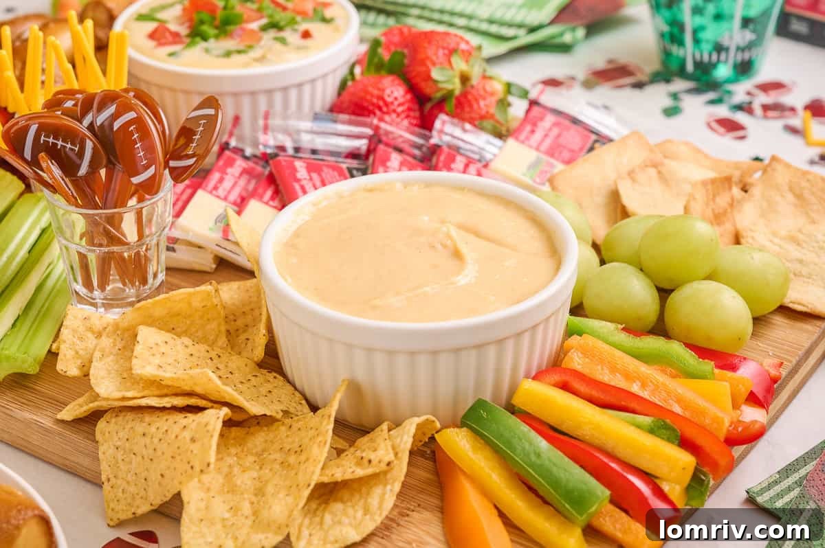 An overhead view of the Game Day charcuterie board, artfully arranged with various snacks and dips.