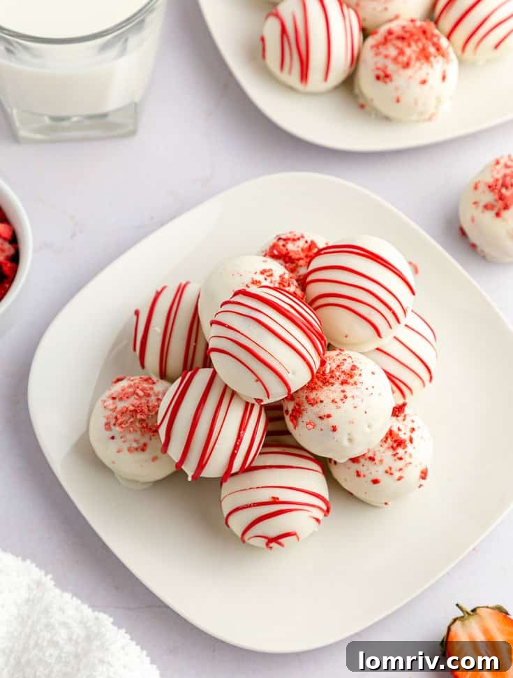 A final shot of a plate of strawberry cake balls, inviting and ready for a sweet moment.