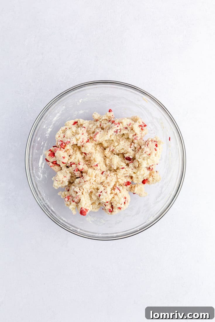 A closer view of the dough after freeze-dried strawberries have been thoroughly mixed in, ready for chilling.