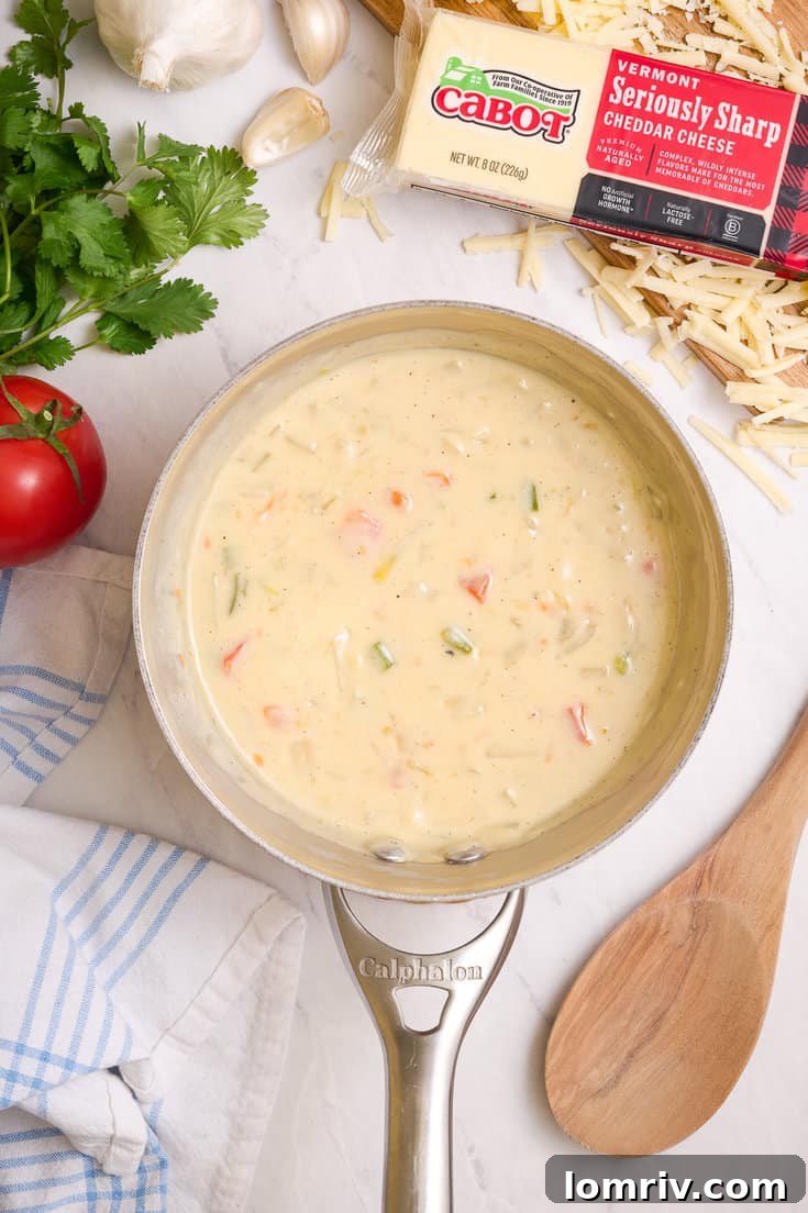 Making homemade queso dip.