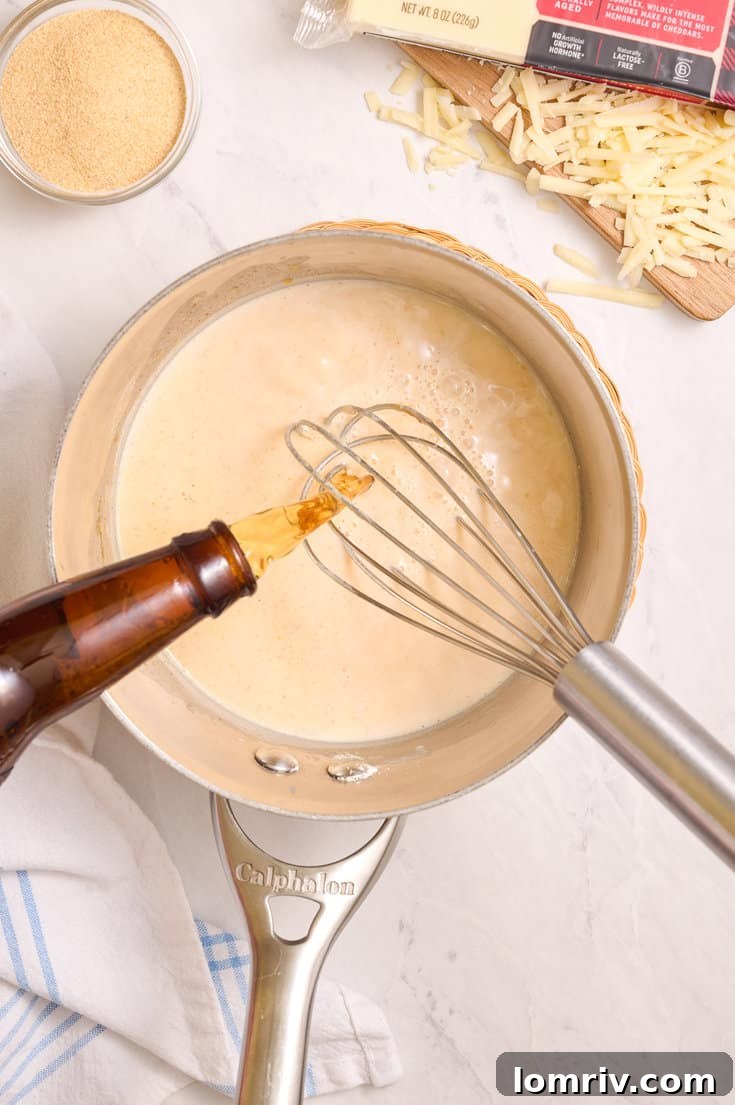 Making beer cheddar cheese dip.