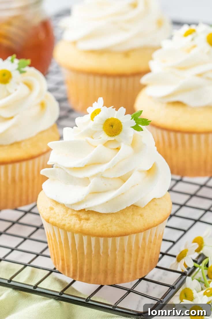 Chamomile cupcakes on a cooling rack.