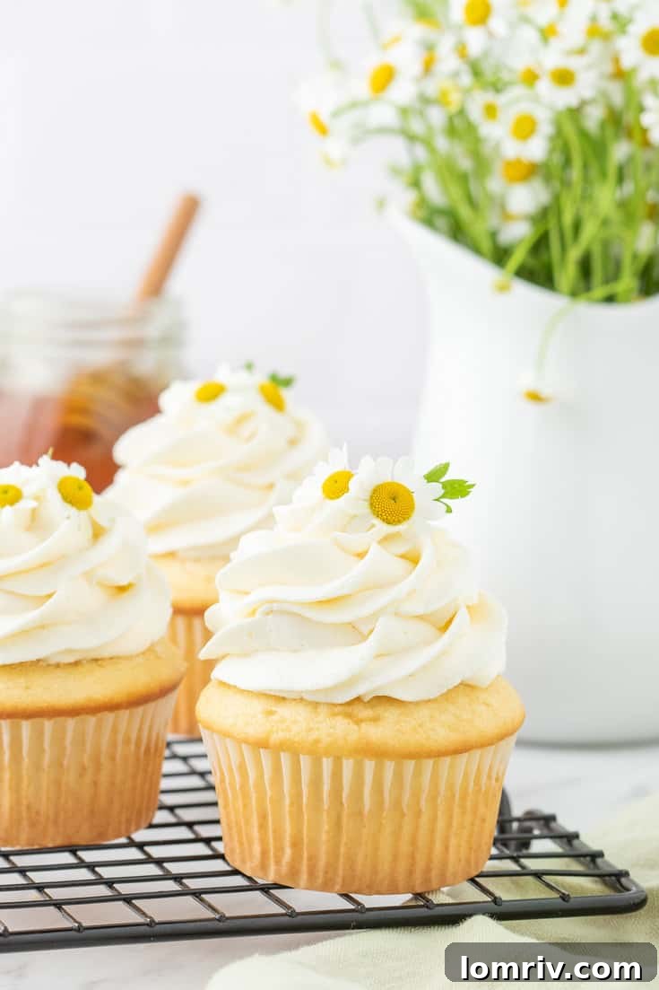 Chamomile cupcakes on a cooling rack.