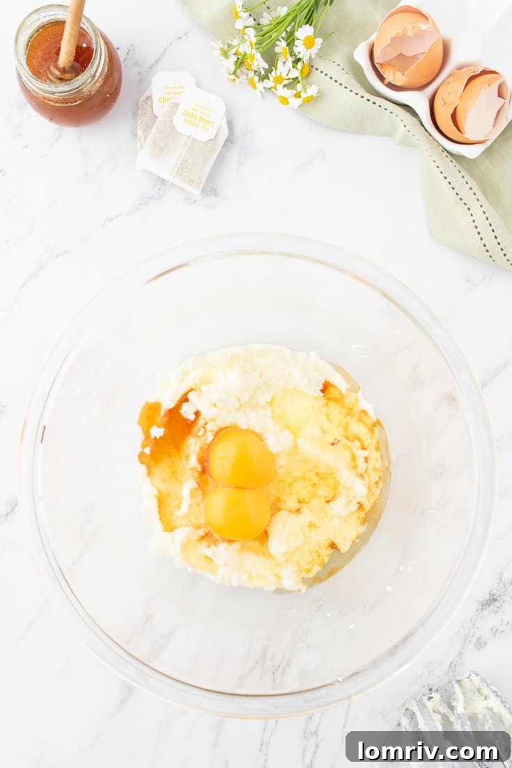 Creaming the butter and adding the eggs.