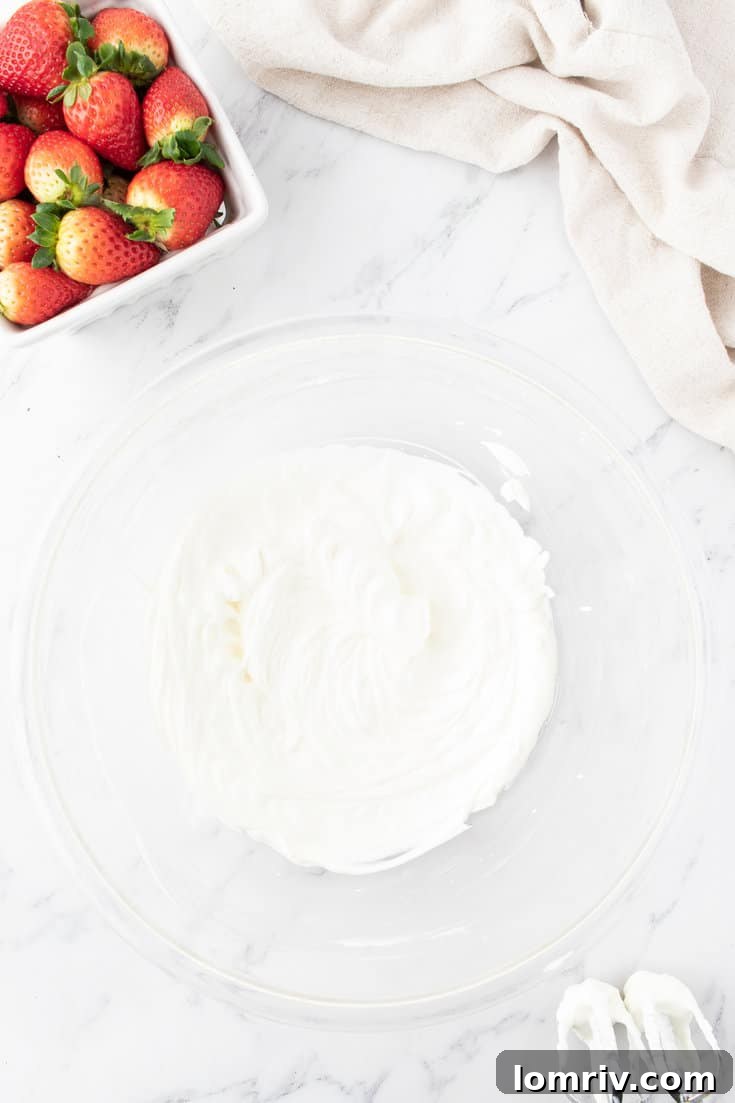 Whipping the heavy whipping cream. 
