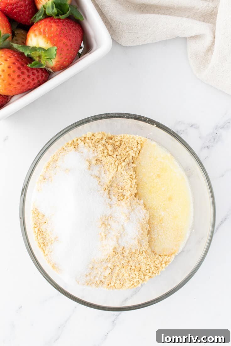 Mixing the cheesecake crust. 