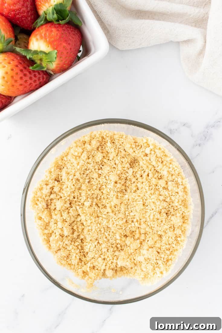 Mixing the cheesecake crust. 
