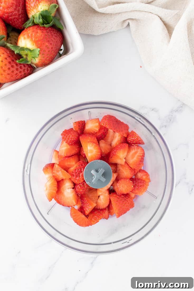 Making the strawberry puree. 