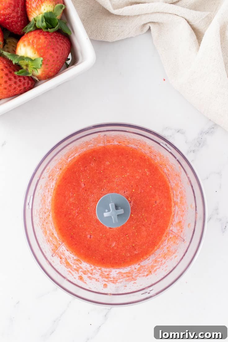 Making the strawberry puree. 