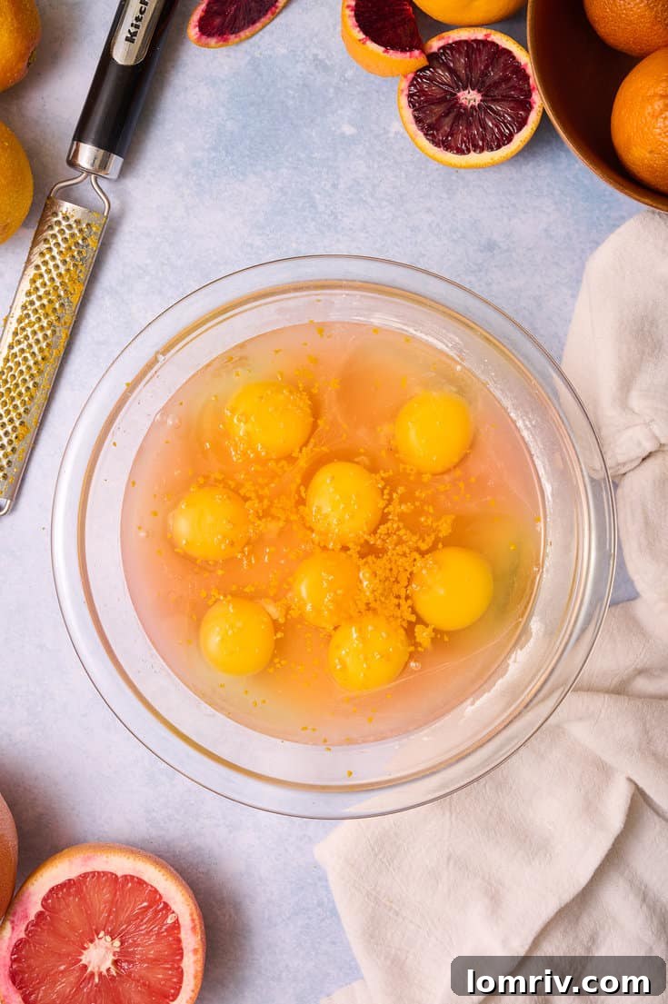 Adding the eggs to the grapefrui filling.