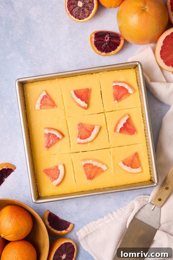 Grapefruit bars garnished with slices of grapefruit.
