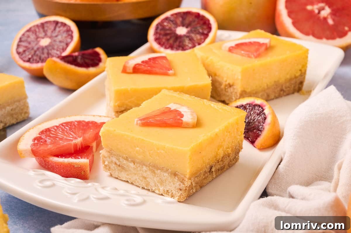 Grapefruit bars on a plate.
