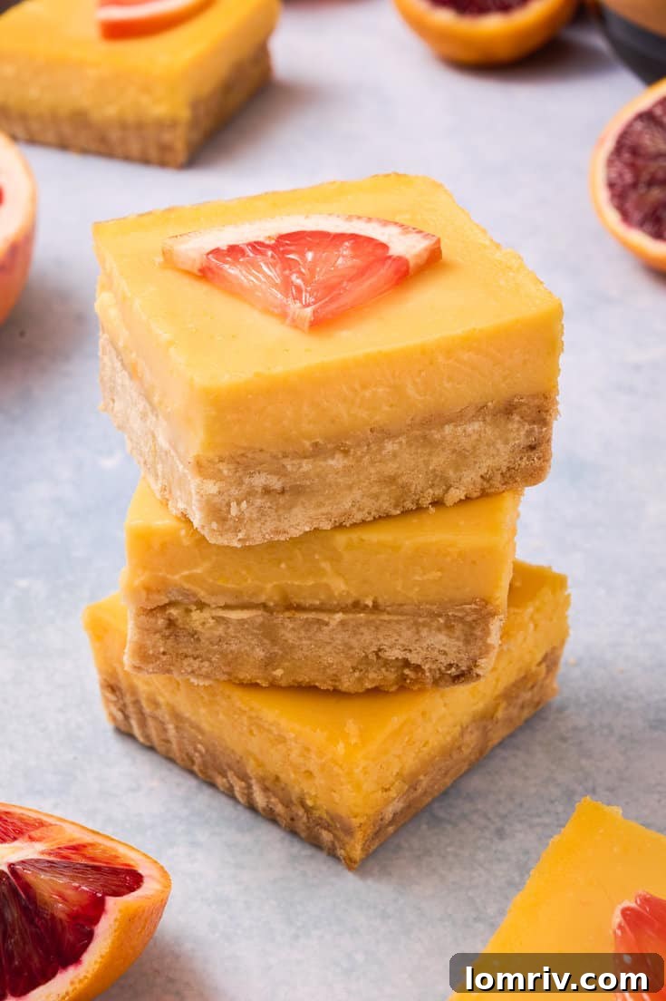 Grapefruit bars stacked on top of each other.