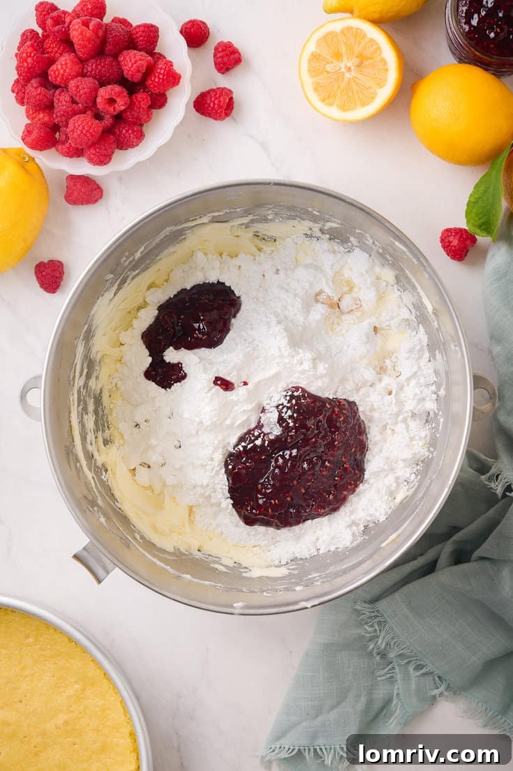 The perfectly mixed lemon cake batter, showcasing its smooth and consistent texture, ready to be divided into baking pans.