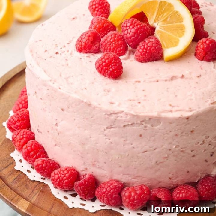 Lemon Raspberry Cake on a cake stand.