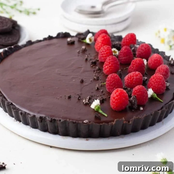 Finished No Bake Chocolate Tart garnished with raspberries
