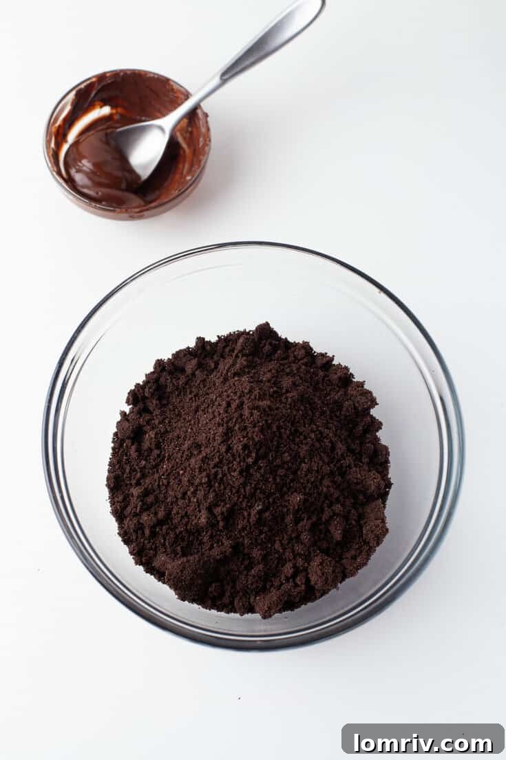 Finely crushed Oreo cookies in a bowl for the tart crust