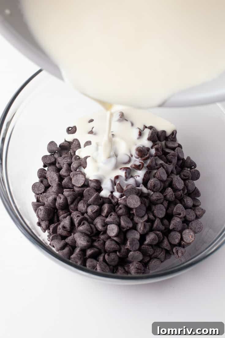 Hot cream and butter mixture poured over chocolate chips for ganache