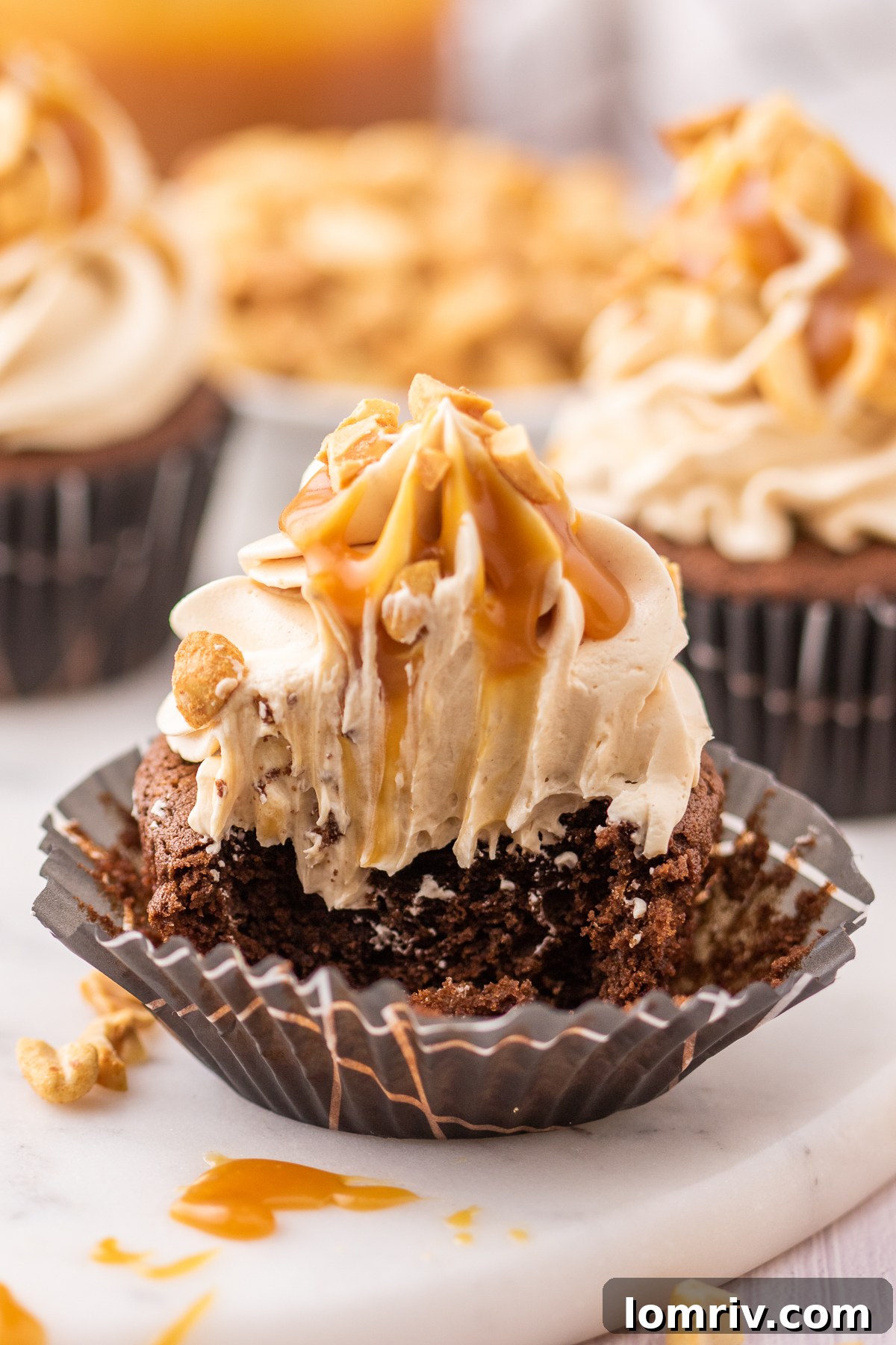 Snickers Cupcakes with a bite out of it. 