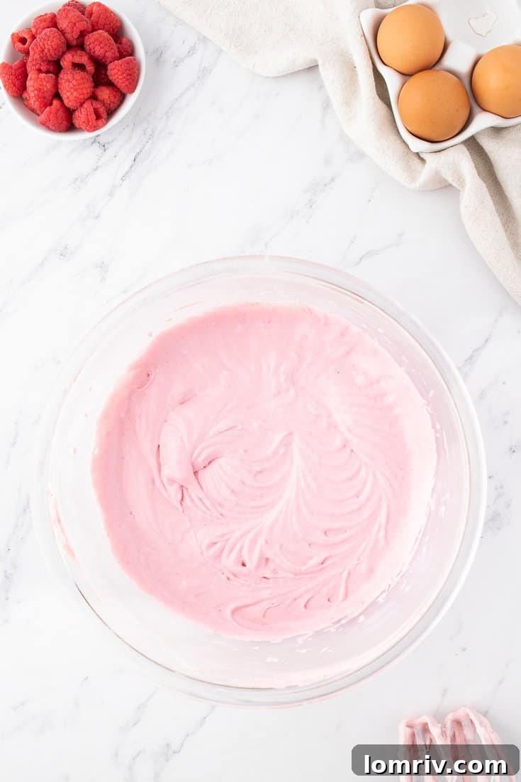 A smooth and evenly combined raspberry cheesecake batter