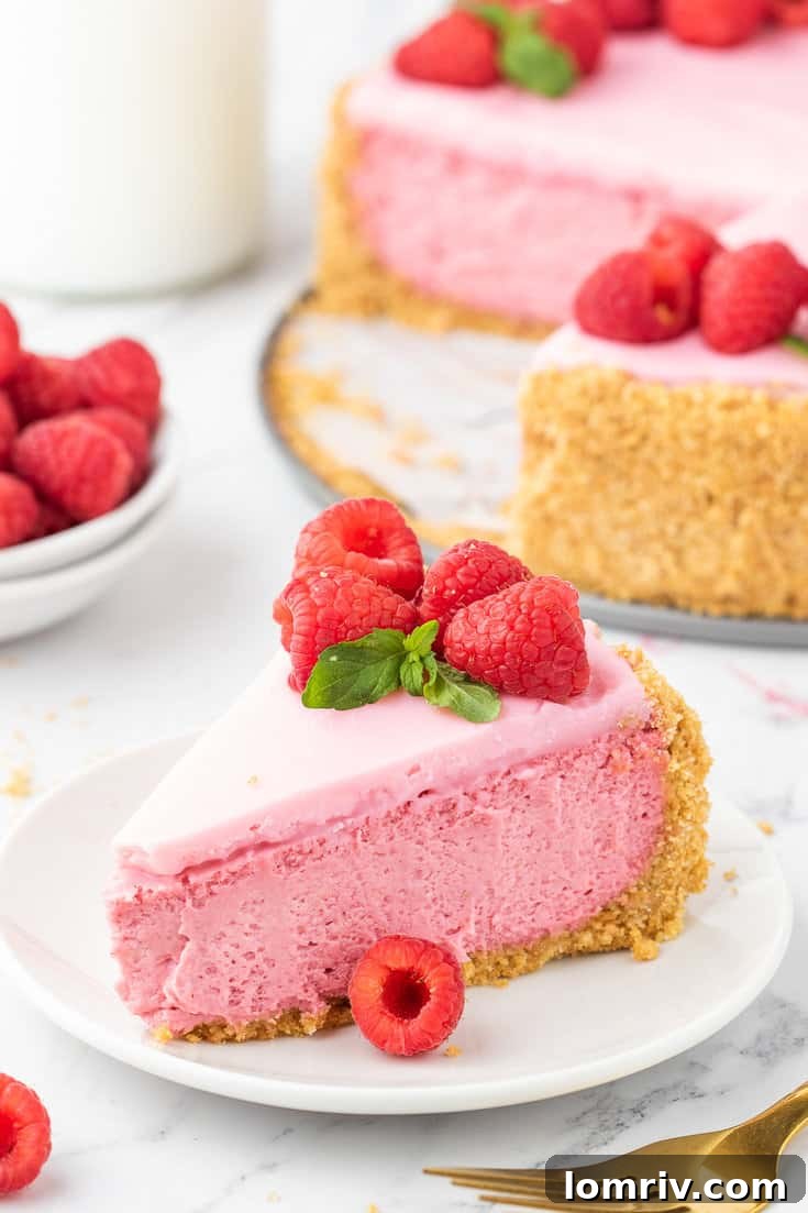 Whole Raspberry Cheesecake on a rustic wooden stand, ready to be served