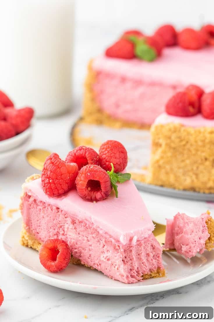 Top view of Raspberry Cheesecake with a glossy white chocolate ganache