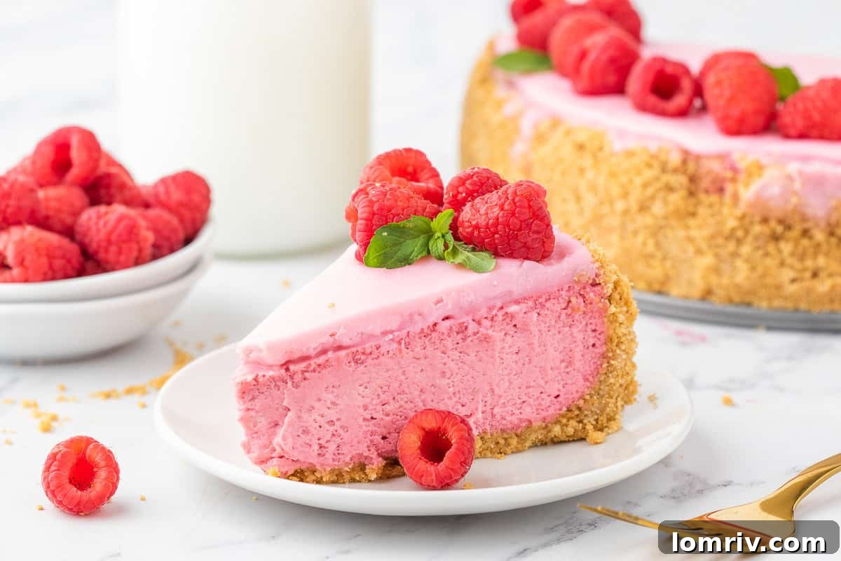 Plates of Raspberry Cheesecake slices on a table, ready to be served