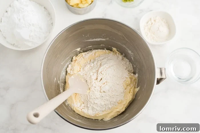 Step 3: Folding pineapple into cake batter by hand