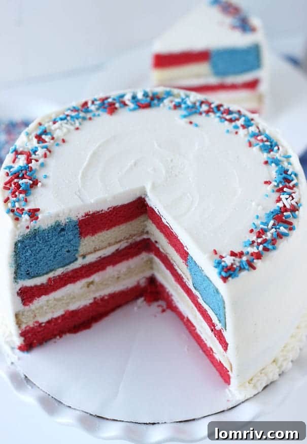Decorated slice of red, white, and blue flag cake showing layers