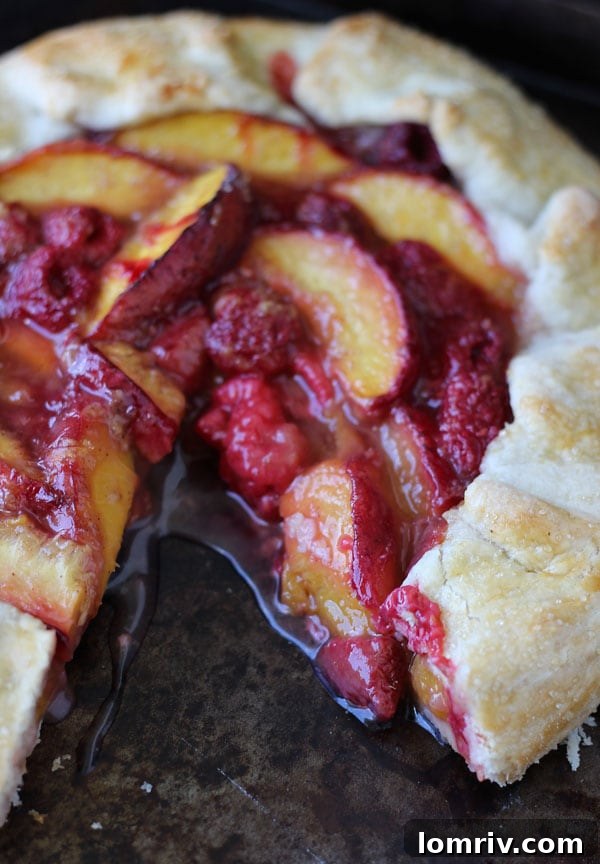 Sliced Peach Raspberry Galette with juicy filling